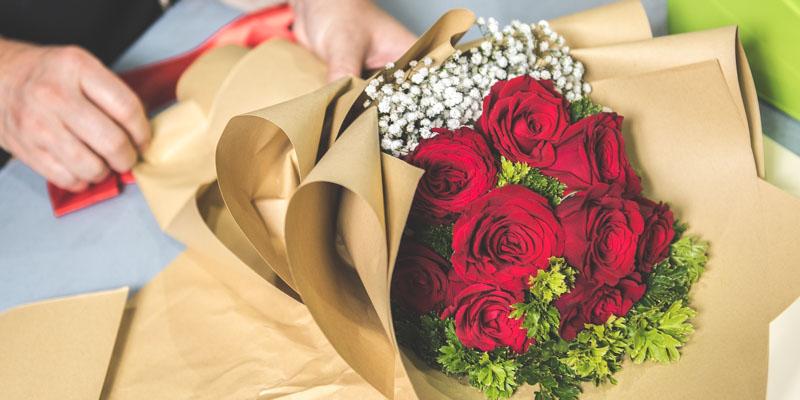 Image 3: preparing fresh flowers for customer